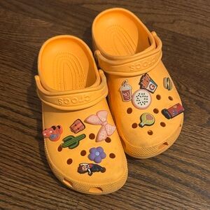 CROCS Orange Clogs with Decorative Charms